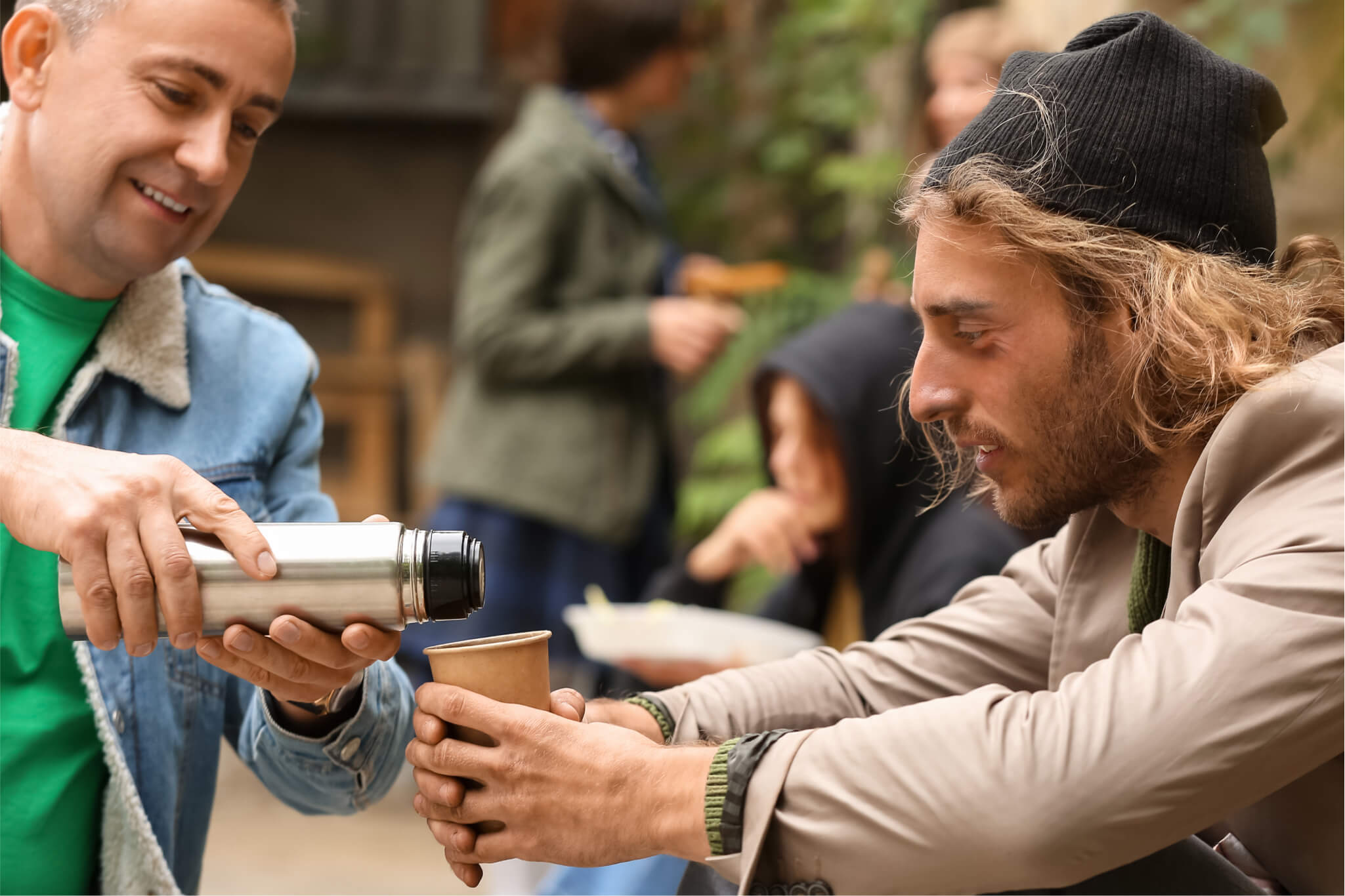 Man at shelter being served water